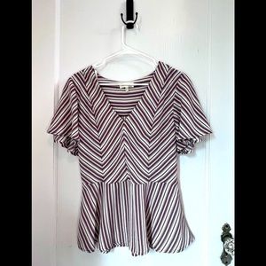 Pink and purple striped top with flare at waist